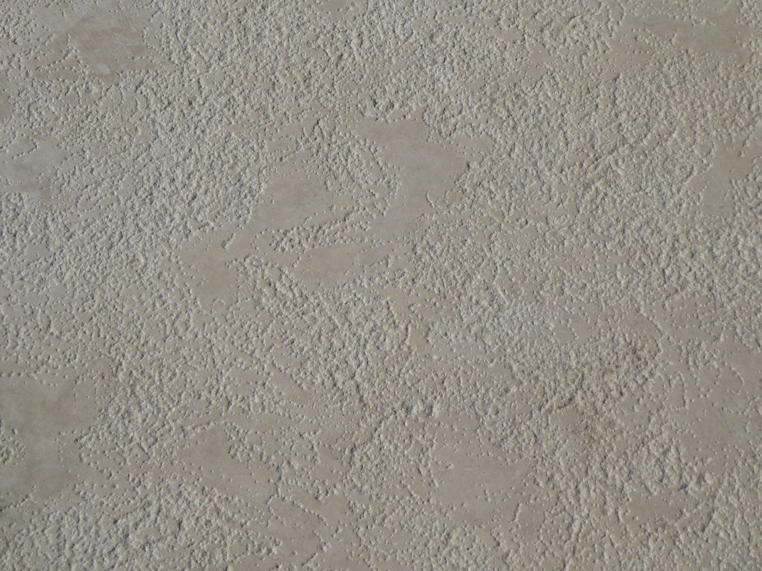 Surface béton beige texturée gros plan